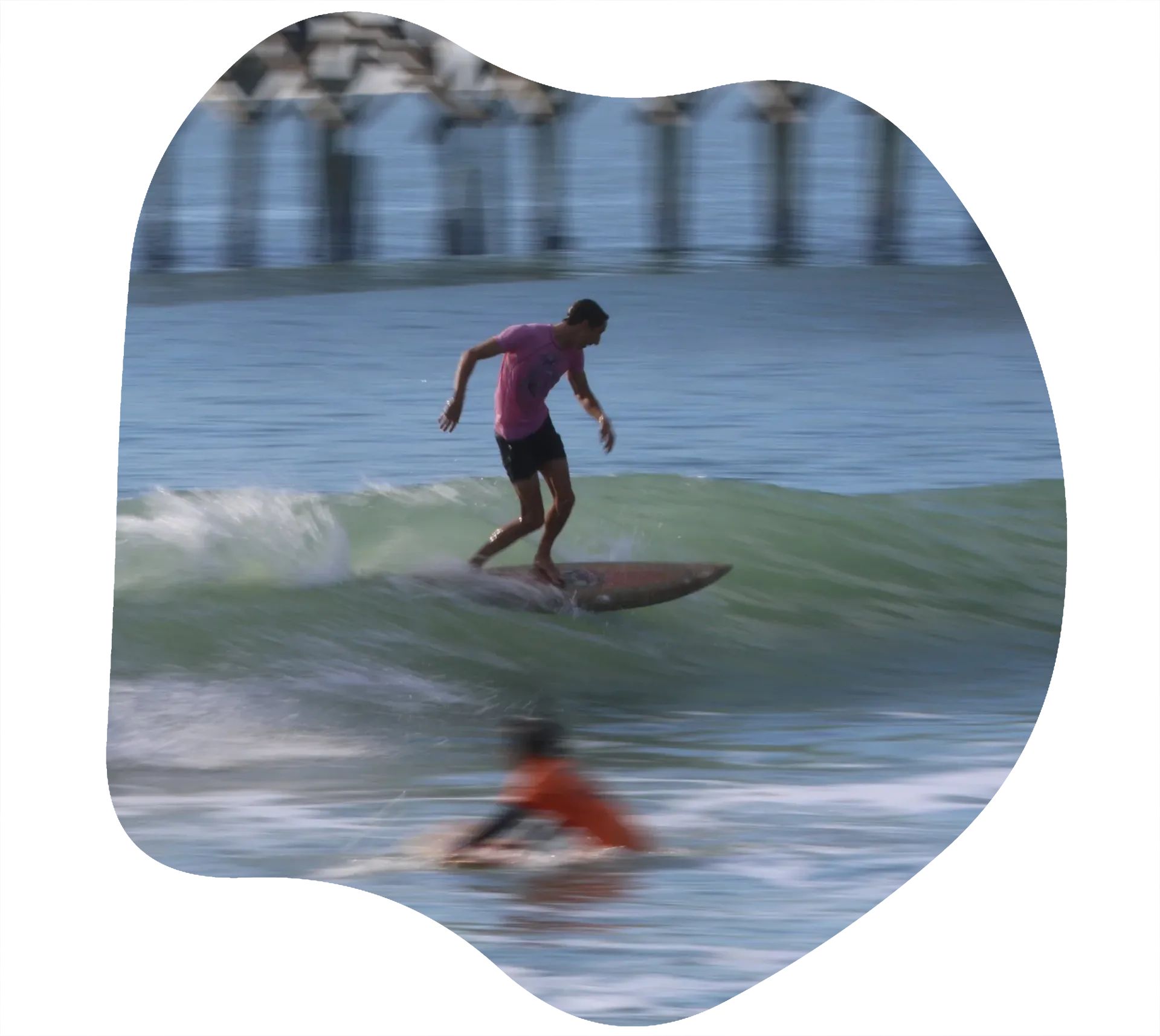 Man surfing red t-shirt